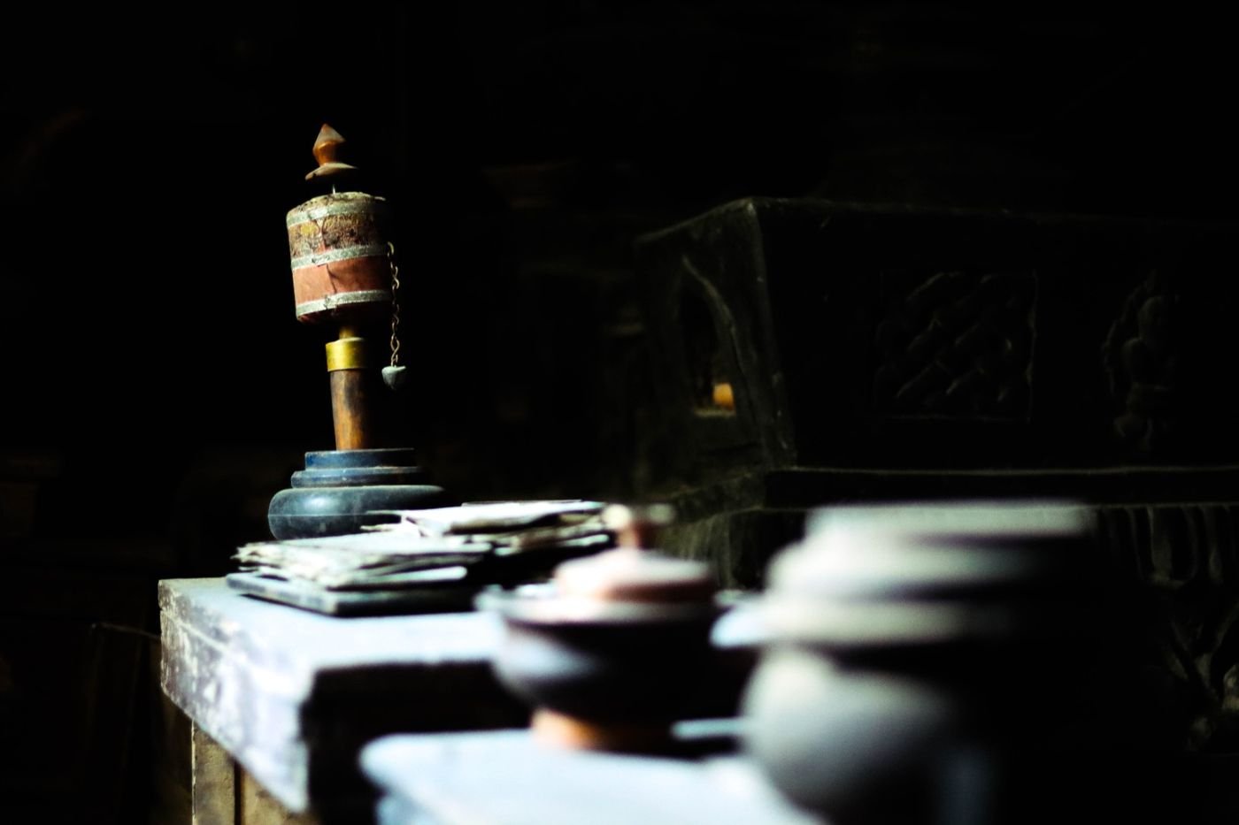 A prayer wheel in the window light