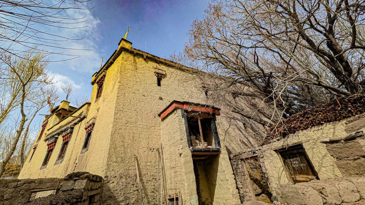 The 200-year-old house against a clear blue sky